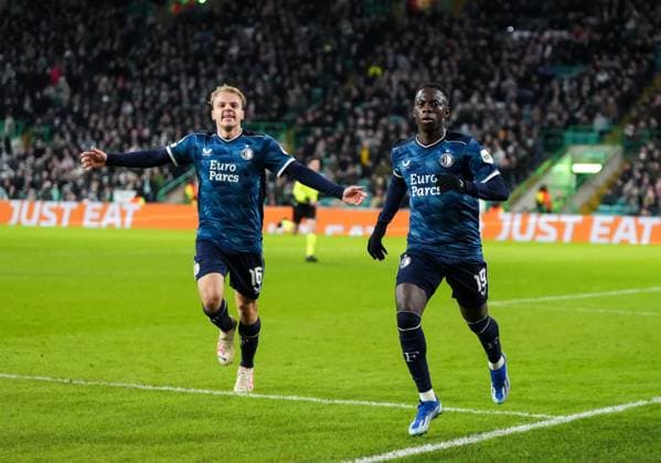 Yankuba Minteh of Feyenoord celebrates scoring to tie the game 1-1, with Thomas van den Belt of Feyenoord, left. Celtic v Feyenoord, UEFA Champions League, Group E, Football, Celtic Park, Glasgow, UK - 13 Dec 2023 EDITORIAL USE ONLY No use with unauthorised audio, video, data, fixture lists, club league logos or live services. Online in-match use limited to 120 images, no video emulation. No use in betting, games or single club league player publications. Copyright: xStuartxWallace Shutterstockx 14254242ar