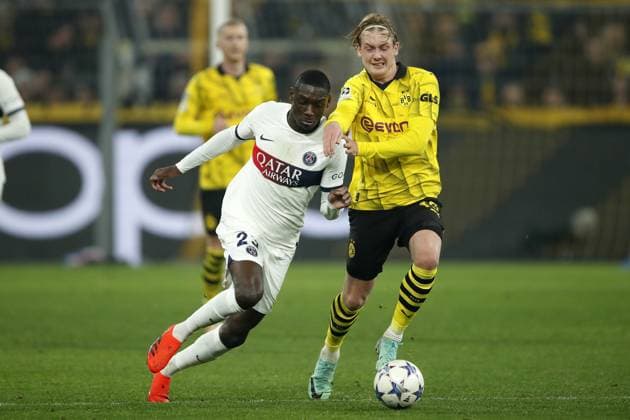 DORTMUND - (l-r) Randal Kolo Muani of Paris Saint-Germain, Julian Brandt of Borussia Dortmund during the UEFA Champions League Group F match between Borussia Dortmund and Paris Saint-Germain at Signal Iduna Park on December 13, 2023 in Dortmund, Germany. ANP Hollandse Hoogte Bart Stoutjesdijk UEFA Champions League 2023 24 2023 2024 xVIxANPxSportx xBartxStoutjesdijkxIVx 486232012 originalFilename: 486232012.jpg