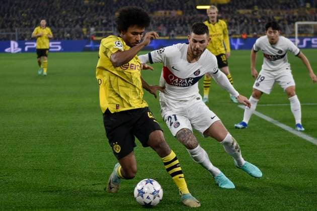 v. li. im Zweikampf Karim Adeyemi ( 27, Borussia Dortmund) Lucas Hernandez ( 21, Paris Saint-Germain) 13.12.2023 Fussball, Champions League, Borussia Dortmund vs Paris St. Germain, Signal Iduna Park, Dortmund, NRW Germany