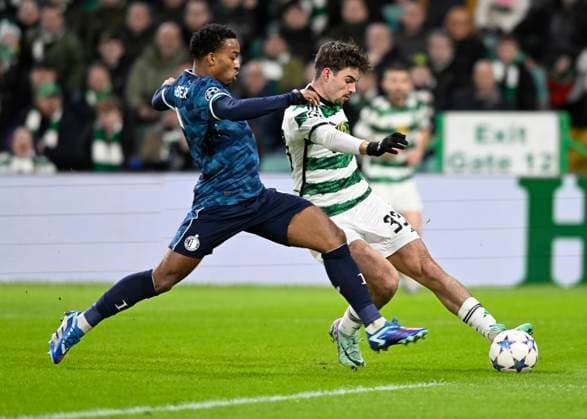 Glasgow, Scotland, 13th December 2023. Quinten Timber of Feyenoord and Matt O Riley of Celtic during the UEFA Champions League match at Celtic Park, Glasgow. Picture credit should read: Neil Hanna Sportimage EDITORIAL USE ONLY. No use with unauthorised audio, video, data, fixture lists, club league logos or live services. Online in-match use limited to 120 images, no video emulation. No use in betting, games or single club league player publications. SPI-2799-0107