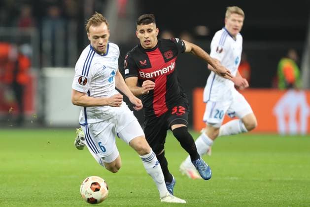 Germany, Leverkusen, 14.12.2023, BayArena, Bayer Leverkusen vs Molde FK - UEFA Europa League 2023 2024 - Group H, Martin Ellingsen (Molde FK) und Gustavo Puerta (Bayer 04 Leverkusen) battle for the ball Leverkusen BayArena North Rhine-Westfalia Germany