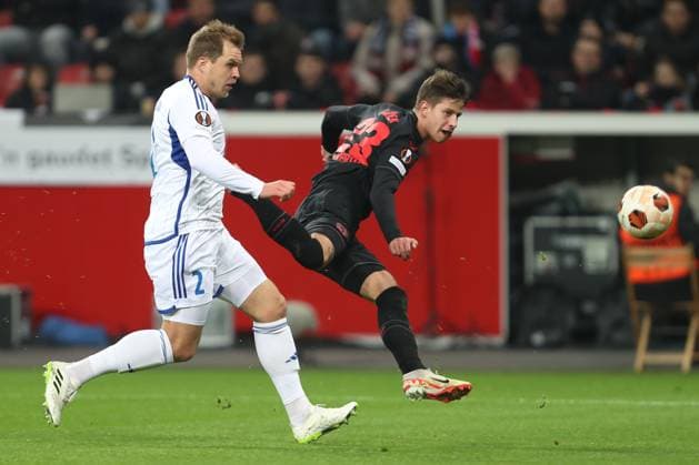 Germany, Leverkusen, 14.12.2023, BayArena, Bayer Leverkusen vs Molde FK - UEFA Europa League 2023 2024 - Group H, Martin Bjornbak (Molde FK) und Adam Hlozek (Bayer 04 Leverkusen) battle for the ball Leverkusen BayArena North Rhine-Westfalia Germany