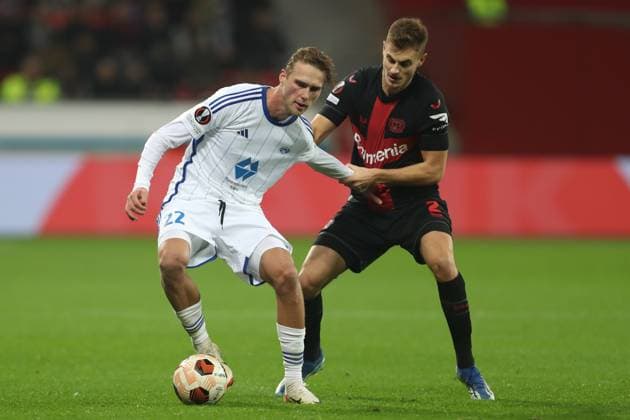 Germany, Leverkusen, 14.12.2023, BayArena, Bayer Leverkusen vs Molde FK - UEFA Europa League 2023 2024 - Group H, Magnus Grodem (Molde FK) und Josip Stanisic (Bayer 04 Leverkusen) battle for the ball Leverkusen BayArena North Rhine-Westfalia Germany