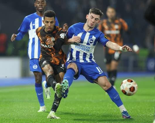 Brighton and Hove, England, 14th December 2023. Azzedine Ounahi of Olympique de Marseille and Billy Gilmour of Brighton and Hove Albion challenge for the ball during the UEFA Europa League match at the AMEX Stadium, Brighton and Hove. Picture credit should read: Paul Terry Sportimage EDITORIAL USE ONLY. No use with unauthorised audio, video, data, fixture lists, club league logos or live services. Online in-match use limited to 120 images, no video emulation. No use in betting, games or single club league player publications. SPI-2802-0006
