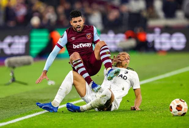 West Ham United v Freiburg Europa League 14 12 2023. Kiliann Sildillia (25) of SC Freiburg brings down Emerson Palmieri (33) of West Ham United during the Europa League match between West Ham United and Freiburg at the London Stadium, London, England on 14 December 2023. Editorial use only , Copyright: xNigelxKeenex PSI-18584-0019