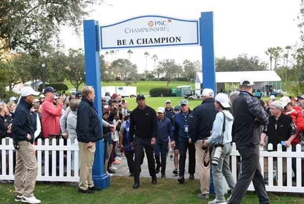 December 15, 2023, Orlando, Florida, United States: Tiger Woods and his son, Charlie Woods, arrive at the first hole to play in the Pro-Am at the PNC Championship golf tournament at the Ritz-Carlton Golf Club. Orlando United States - ZUMAs197 20231215_aab_s197_062 Copyright: xPaulxHennessyx