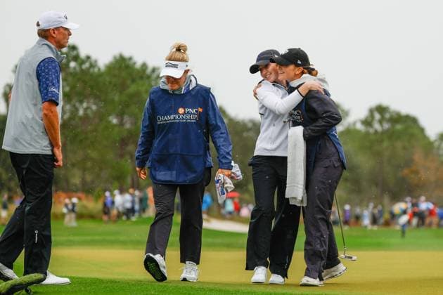 December 16, 2023: Izzy Stricker hugs her sister and dads caddie after Round One of the PNC Championship golf tournament at the Ritz-Carlton Golf Club in Orlando, Florida. CSM Orlando United States of America - ZUMAc04_ 20231216_zma_c04_116 Copyright: xDarrenxLeex