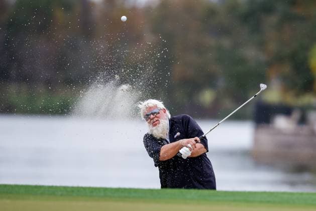 December 16, 2023: John Daly hitting out of the same on the 18th hole during Round One of the PNC Championship golf tournament at the Ritz-Carlton Golf Club in Orlando, Florida. CSM Orlando United States of America - ZUMAc04_ 20231216_zma_c04_204 Copyright: xDarrenxLeex