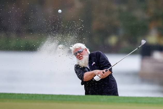 December 16, 2023: John Daly hitting out of the same on the 18th hole during Round One of the PNC Championship golf tournament at the Ritz-Carlton Golf Club in Orlando, Florida. CSM Orlando United States of America - ZUMAc04_ 20231216_zma_c04_225 Copyright: xDarrenxLeex