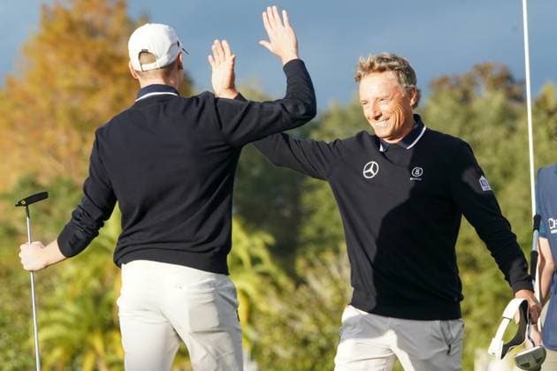 December 17, 2023, Orlando, Florida, USA: Bernhard Langer (R) and his son, Jason, high five on the 18th green after winning the final round of the 2023 PNC Championship at Ritz-Carlton Golf Club. Orlando USA - ZUMAw109 20231217_fap_w109_043 Copyright: xDebbyxWongx