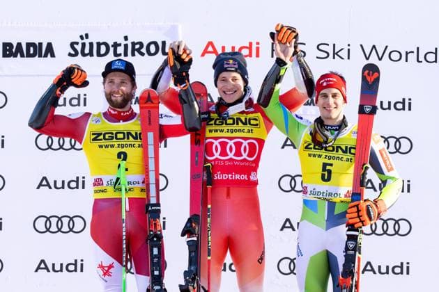 Bilder des Jahres 2023, Sport 12 Dezember Sport Themen der Woche KW51 Sport Bilder des Tages December 18, 2023, ALTA BADIA, Italy: Second placed Marco Schwarz (L) of Austria, winner Marco Odermatt (C) of Switzerland and third placed Zan Kranjec (R) of Slovenia celebrate on the podium after the Men s Giant Slalom race of the Alpine Skiing World Cup in Alta Badia, Italy, 18 December 2023. ANSA ANDREA SOLERO Alpine skiing World Cup in Alta Badia  - ZUMAa110 20231218_zaf_a110_018 Copyright: xAndreaxSolerox
