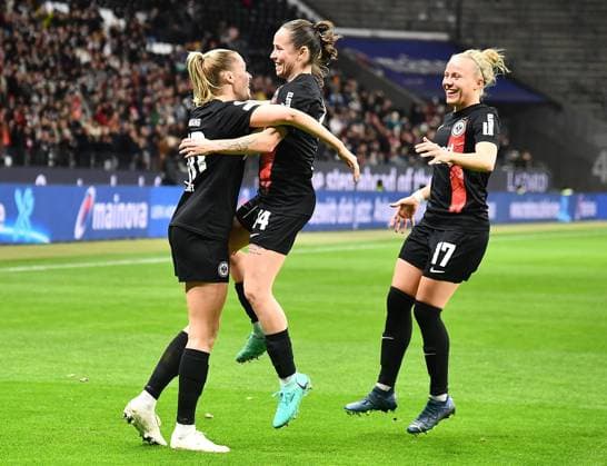21.12.2023, xhbx, Fussball Champions League Frauen, Eintracht Frankfurt Frauen - SL Benfica Lissabon emspor, v.l. Torjubel, Goal celebration, celebrate the goal 1:0 Laura Freigang (Eintracht Frankfurt Damen), Geraldine Reuteler (Eintracht Frankfurt Damen), Pia-Sophie Wolter (Eintracht Frankfurt Damen) (DFL DFB REGULATIONS PROHIBIT ANY USE OF PHOTOGRAPHS as IMAGE SEQUENCES and or QUASI-VIDEO) Frankfurt am Main
