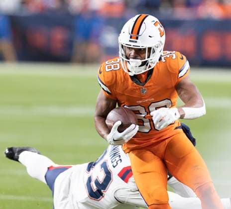 December 24, 2023, Denver, Colorado, USA: Broncos RB JALEEL MCLAUGHLIN runs for yardage against the Patriots Sunday night at Empower Field at Mile High in Denver, CO. The Patriots beat the Broncos 26-23. Denver USA - ZUMAav4_ 20231224_zaf_av4_001 Copyright: xHectorxAcevedox