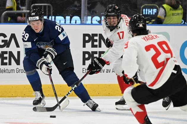 Lenni Hämeenaho (L) of Finland vies the puck with Macklin Celebrini of Canada during Ice hockey, Eishockey 2024 IIHF World Junior U20 Championship tournament match between Finland and Canada in Gothenburg, Sweden, on December 26, 2023. Gothenburg Sweden LKFTJK20231226163534LCQD  Copyright: xJussixNukarix LKFTJK20231226163534LCQD