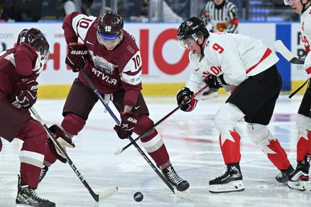 GOTHENBURG, SWEDEN 20231227 Latvia s Emils Veckaktins against Canada s Nate Danielson during the IIHF World Junior Championship group A Ice hockey, Eishockey match between Latvia and Canada at Scandinavium in Gothenburg, Sweden December 27, 2023. GOTHENBURG SWEDEN x9200x