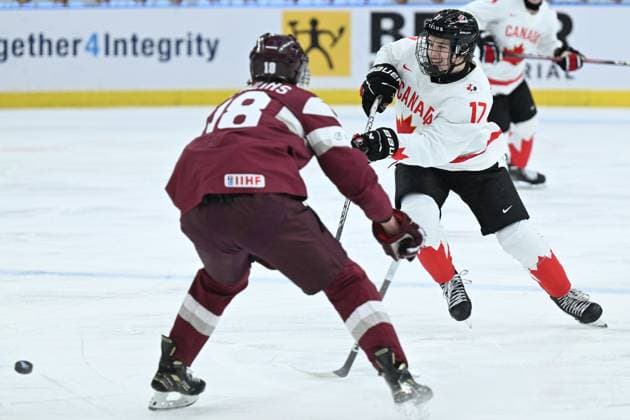 GOTHENBURG, SWEDEN 20231227 Latvia s Renarts Berzins against Canada s Macklin Celebrini during the IIHF World Junior Championship group A Ice hockey, Eishockey match between Latvia and Canada at Scandinavium in Gothenburg, Sweden December 27, 2023. GOTHENBURG SWEDEN x9200x