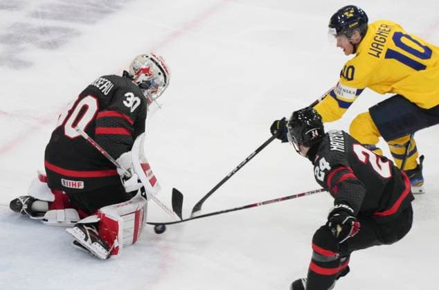 December 29, 2023, GOTHENBURG, SWEDEN: Canada goaltender Mathis Rousseau (30) makes a save over Sweden s Fabian Wagner (10) as Canada s Denton Mateychuk (24) skates in to defend during third period action at the IIHF World Junior Hockey Championship in Gothenburg, Sweden, Friday, Dec. 29, 2023. Canada News - December 29, 2023  - ZUMAc35_ 20231229_zaf_c35_048 Copyright: xChristinnexMuschix