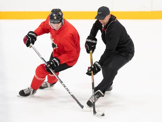 December 30, 2023, GOTHENBURG, SWEDEN: Canada head coach Alan Letang, right, strips the puck off Canada s Fraser Minten during a drill at a practice session at the IIHF World Junior Hockey Championship in Gothenburg, Sweden on Saturday, Dec. 30, 2023. Canada News - December 30, 2023  - ZUMAc35_ 20231230_zaf_c35_007 Copyright: xChristinnexMuschix