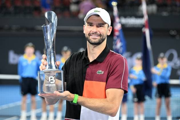 TENNIS BRISBANE INTERNATIONAL, Grigor Dimitrov of Bulgaria celebrates with the trophy after winning the men?s Final against Holger Rune of Denmark on Day 8 of the 2024 Brisbane International at the Queensland Tennis Centre in Brisbane, Sunday, January 7, 2024. ( NO ARCHIVING, EDITORIAL USE ONLY, NO USE IN BOOKS WITHOUT CONSENT BRISBANE QUEENSLAND AUSTRALIA  Copyright: xDARRENxENGLANDx 20240107001885892025