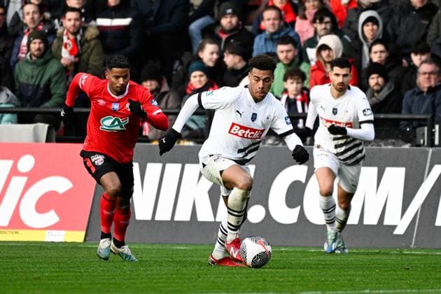 Doue Desire ( 10 - Rennes ) and Louiserre Dylan ( 4 - Guingamp ) during the French Cup match between EA Guingamp and Stade Rennais at Stade du Roudourou on January 07, 2024 in Guingamp, France. ( Photo by federico pestellini panoramic ) - FOOTBALL : Guingamp vs Rennes - Coupe de France - 07 01 2024 FedericoPestellini Panoramic 