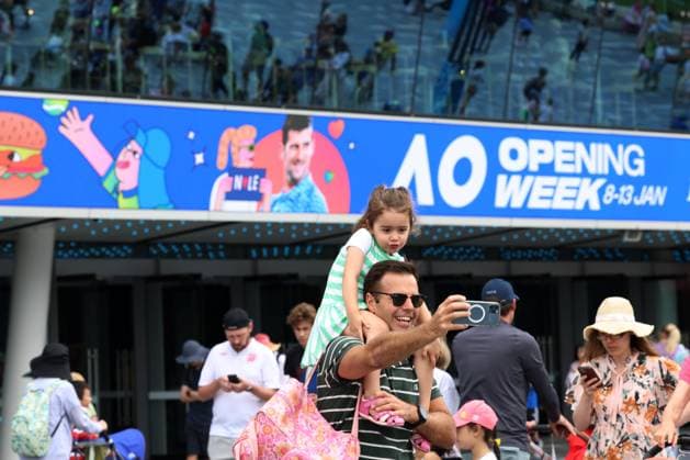 (240113) -- MELBOURNE, Jan. 13, 2024 -- People take selfies during the Kids Tennis Day at Melbourne Park in Melbourne, Australia, Jan. 13, 2024. The Kids Tennis Day provides activities and entertainment for kids and families. The 2024 Australian Open will be held from Jan. 14 to 28. (Photo by Xinhua) (SP)AUSTRALIA-MELBOURNE-TENNIS-AUSTRALIAN OPEN-KIDS TENNIS DAY ChuxChen 