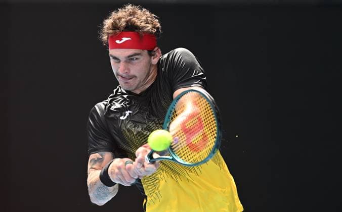 TENNIS AUSTRALIAN OPEN, Thiago Seyboth Wild of Brazil returns during his first round match against Andrey Rublev of Russia on Day 1 of the 2024 Australian Open at Melbourne Park in Melbourne, Sunday, January 14, 2024. ( NO ARCHIVING, EDITORIAL USE ONLY, NO USE IN BOOKS WITHOUT CONSENT MELBOURNE VICTORIA AUSTRALIA  Copyright: xJOELxCARRETTx 20240114001888762345