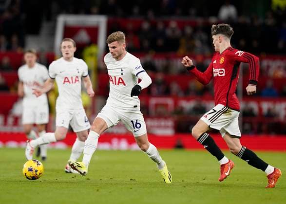 Sport Themen der Woche KW02 Sport Bilder des Tages Manchester, England, 14th January 2024. Timo Werner of Tottenham runs ahead of Alejandro Garnacho of Manchester United, ManU during the Premier League match at Old Trafford, Manchester. Picture credit should read: Andrew Yates Sportimage EDITORIAL USE ONLY. No use with unauthorised audio, video, data, fixture lists, club league logos or live services. Online in-match use limited to 120 images, no video emulation. No use in betting, games or single club league player publications. SPI-2871-0029