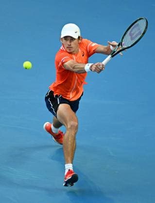 TENNIS AUSTRALIAN OPEN, Alex De Minaur of Australia returns during his first round match against Milos Raonic of Canada on Day 2 of the 2024 Australian Open at Melbourne Park in Melbourne, Monday, January 15, 2024. ( NO ARCHIVING, EDITORIAL USE ONLY, NO USE IN BOOKS WITHOUT CONSENT MELBOURNE VICTORIA AUSTRALIA  Copyright: xLUKASxCOCHx 20240115001889250502