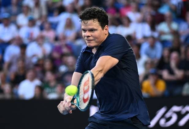 TENNIS AUSTRALIAN OPEN, Milos Raonic of Canada returns during his first round match against Alex De Minaur of Australia on Day 2 of the 2024 Australian Open at Melbourne Park in Melbourne, Monday, January 15, 2024. ( NO ARCHIVING, EDITORIAL USE ONLY, NO USE IN BOOKS WITHOUT CONSENT MELBOURNE VICTORIA AUSTRALIA  Copyright: xJOELxCARRETTx 20240115001889251454