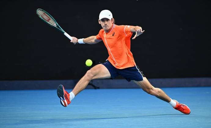 TENNIS AUSTRALIAN OPEN, Alex De Minaur of Australia stretches to return during his first round match against Milos Raonic of Canada on Day 2 of the 2024 Australian Open at Melbourne Park in Melbourne, Monday, January 15, 2024. ( NO ARCHIVING, EDITORIAL USE ONLY, NO USE IN BOOKS WITHOUT CONSENT MELBOURNE VICTORIA AUSTRALIA  Copyright: xJOELxCARRETTx 20240115001889251977