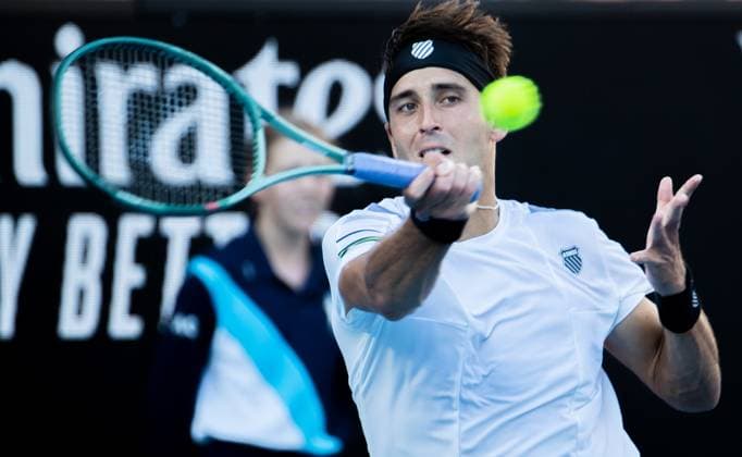 (240115) -- MELBOURNE, Jan. 15, 2024 -- Tomas Martin Etcheverry of Argentina hits a return during the men s singles first round match between Andy Murray of Britain and Tomas Martin Etcheverry of Argentina at Australian Open tennis tournament in Melbourne, Australia, Jan. 15, 2024. (Photo by Xinhua) (SP)AUSTRALIA-MELBOURNE-TENNIS-AUSTRALIAN OPEN HuxJingchen 