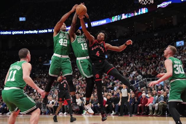 Sport Themen der Woche KW03 Sport Bilder des Tages January 15, 2024, Toronto, On, CANADA: Toronto Raptors forward Scottie Barnes (4) jumps with Boston Celtics centre Al Horford (42) and Celtics forward Oshae Brissett (12) for control of the ball during first half NBA, Basketball Herren, USA basketball action in Toronto Monday Jan. 15, 2024. Canada News - January 15, 2024  - ZUMAc35_ 20240115_zaf_c35_027 Copyright: xNathanxDenettex
