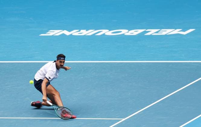 (240118) -- MELBOURNE, Jan. 18, 2024 -- Lorenzo Sonego of Italy hits a return during the men s singles second round match between Carlos Alcaraz of Spain and Lorenzo Sonego of Italy at Australian Open tennis tournament in Melbourne, Australia, Jan. 18, 2024. ) (SP)AUSTRALIA-MELBOURNE-TENNIS-AUSTRALIAN OPEN MaxPing 