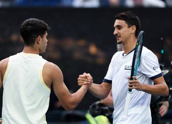 (240118) -- MELBOURNE, Jan. 18, 2024 -- Carlos Alcaraz (L) of Spain and Lorenzo Sonego of Italy shake hands after their men s singles second round match at Australian Open tennis tournament in Melbourne, Australia, Jan. 18, 2024. ) (SP)AUSTRALIA-MELBOURNE-TENNIS-AUSTRALIAN OPEN MaxPing 