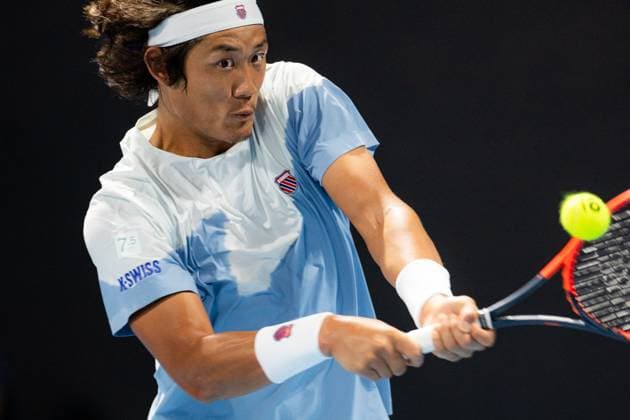 (240118) -- MELBOURNE, Jan. 18, 2024 -- Zhang Zhizhen of China hits a return during the men s singles second round match Ugo Humbert of France and Zhang Zhizhen of China at the Australian Open tennis tournament in Melbourne, Australia, Jan. 18, 2024. (Photo by Xinhua) (SP)AUSTRALIA-MELBOURNE-TENNIS-AUSTRALIAN OPEN ChuxChen 