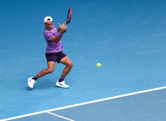 (240119) -- MELBOURNE, Jan. 19, 2024 -- Sebastian Baez of Argentina returns a shot during the men s singles 3rd round match between Jannik Sinner of Italy and Sebastian Baez of Argentina at Australian Open tennis tournament in Melbourne, Australia, Jan. 19, 2024. ) (SP)AUSTRALIA-MELBOURNE-TENNIS-AUSTRALIAN OPEN MaxPing 