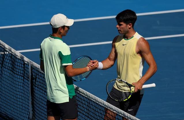 Carlos Alcaraz of Spain shakes hands with Juncheng Shang of China Australian Open, Day Seven, Tennis, Melbourne Park, Melbourne, Australia - 20 Jan 2024  Copyright: xEllaxLing Shutterstockx 14306285aa