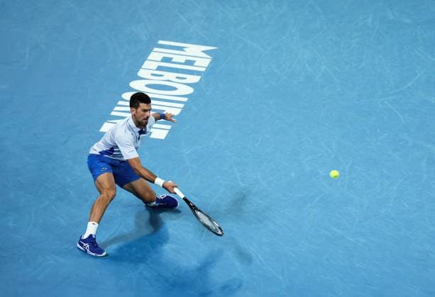 (240121) -- MELBOURNE, Jan. 21, 2024 -- Novak Djokovic of Serbia returns a shot during the men s singles 4th round match between Novak Djokovic of Serbia and Adrian Mannarino of France at Australian Open tennis tournament in Melbourne, Australia, Jan. 21, 2024. ) (SP)AUSTRALIA-MELBOURNE-TENNIS-AUSTRALIAN OPEN MaxPing 