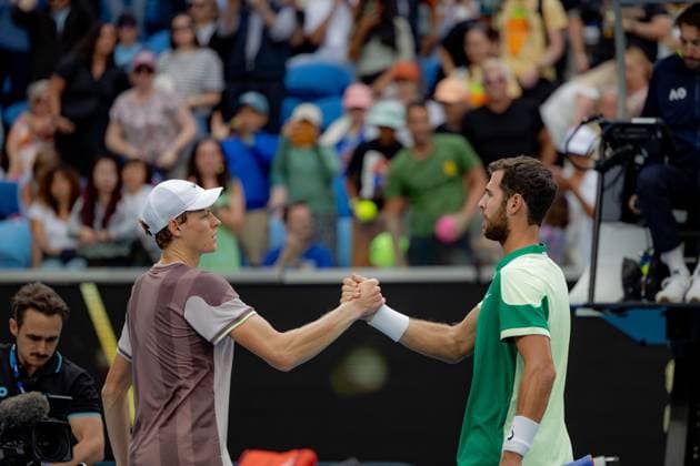 (240121) -- MELBOURNE, Jan. 21, 2024 -- Jannik Sinner (L) of Italy shakes hands with Karen Khachanov of Russia after the men s singles fourth round match at the Australian Open tennis tournament in Melbourne, Australia, Jan. 21, 2024. (Photo by Xinhua) (SP)AUSTRALIA-MELBOURNE-TENNIS-AUSTRALIAN OPEN ChuxChen 