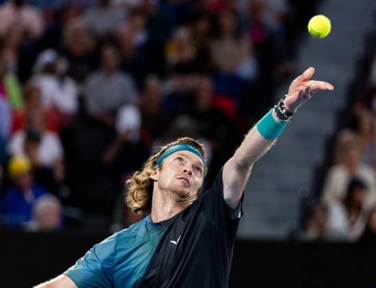 (240121) -- MELBOURNE, Jan. 21, 2024 -- Andrey Rublev of Russia serves during the men s singles fourth round match between Andrey Rublev of Russia and Alex De Minaur of Australia at Australian Open tennis tournament in Melbourne, Australia, Jan. 21, 2024. (Photo by Xinhua) (SP)AUSTRALIA-MELBOURNE-TENNIS-AUSTRALIAN OPEN HuxJingchen 