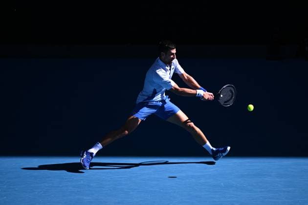 TENNIS AUSTRALIAN OPEN, Novak Djokovic of Serbia plays a return shot during his quarter final match against Taylor Fritz of the USA on Day 10 of the 2024 Australian Open at Melbourne Park in Melbourne, Tuesday, January 23, 2024. ( NO ARCHIVING, EDITORIAL USE ONLY, NO USE IN BOOKS WITHOUT CONSENT MELBOURNE VICTORIA AUSTRALIA  Copyright: xLUKASxCOCHx 20240123001892528294
