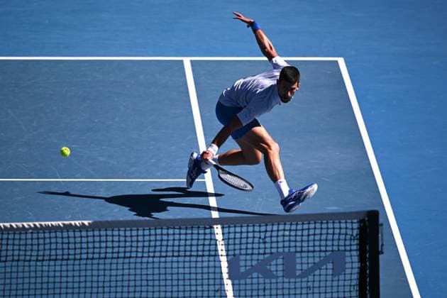 TENNIS AUSTRALIAN OPEN, Novak Djokovic of Serbia plays a return shot during his quarter final match against Taylor Fritz of the USA on Day 10 of the 2024 Australian Open at Melbourne Park in Melbourne, Tuesday, January 23, 2024. ( NO ARCHIVING, EDITORIAL USE ONLY, NO USE IN BOOKS WITHOUT CONSENT MELBOURNE VICTORIA AUSTRALIA  Copyright: xLUKASxCOCHx 20240123001892528604