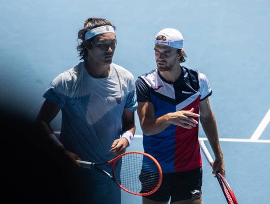 (240123) -- MELBOURNE, Jan. 23, 2024 -- Zhang Zhizhen (L) Tomas Machac communicate with each other during the men s doubles quarterfinal between Zhang Zhizhen (China) Tomas Machac (the Czech Republic) and Ariel Behar (Uruguay) Adam Pavlasek (the Czech Republic) at the Australian Open tennis tournament in Melbourne, Australia, Jan. 23, 2024. (Photo by Xinhua) (SP)AUSTRALIA-MELBOURNE-TENNIS-AUSTRALIAN OPEN HuxJingchen 