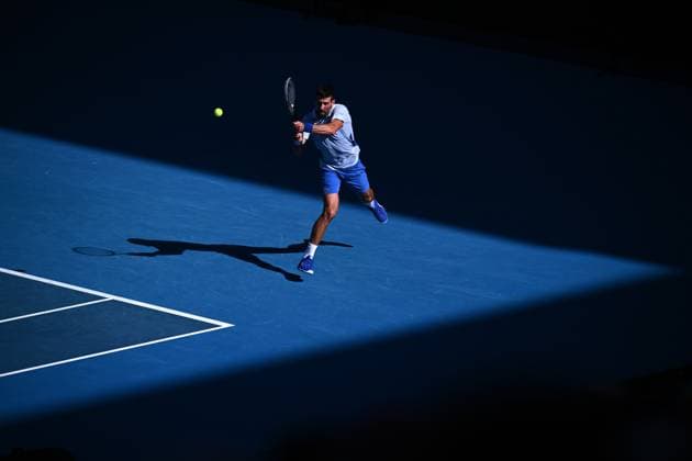 TENNIS AUSTRALIAN OPEN, Novak Djokovic of Serbia plays a return shot during his quarter final match against Taylor Fritz of the USA on Day 10 of the 2024 Australian Open at Melbourne Park in Melbourne, Tuesday, January 23, 2024. ( NO ARCHIVING, EDITORIAL USE ONLY, NO USE IN BOOKS WITHOUT CONSENT MELBOURNE VICTORIA AUSTRALIA  Copyright: xJOELxCARRETTx 20240123001892536987