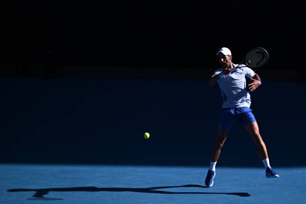 TENNIS AUSTRALIAN OPEN, Novak Djokovic of Serbia plays a return shot during his quarter final match against Taylor Fritz of the USA on Day 10 of the 2024 Australian Open at Melbourne Park in Melbourne, Tuesday, January 23, 2024. ( NO ARCHIVING, EDITORIAL USE ONLY, NO USE IN BOOKS WITHOUT CONSENT MELBOURNE VICTORIA AUSTRALIA  Copyright: xJOELxCARRETTx 20240123001892542139