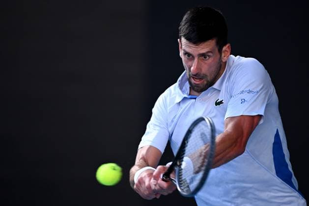 TENNIS AUSTRALIAN OPEN, Novak Djokovic of Serbia plays a return shot during his quarter final match against Taylor Fritz of the USA on Day 10 of the 2024 Australian Open at Melbourne Park in Melbourne, Tuesday, January 23, 2024. ( NO ARCHIVING, EDITORIAL USE ONLY, NO USE IN BOOKS WITHOUT CONSENT MELBOURNE VICTORIA AUSTRALIA  Copyright: xJOELxCARRETTx 20240123001892547527