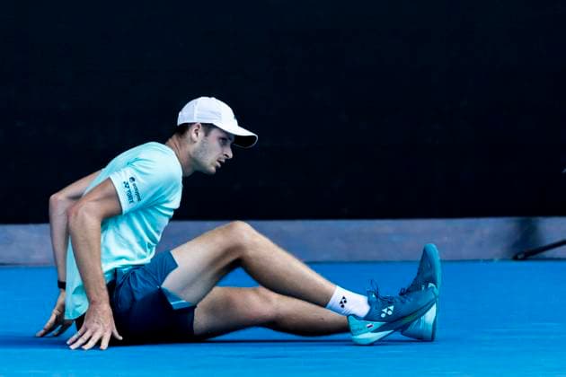 MELBOURNE, VIC - JANUARY 24: Hubert Hurkacz of Poland lays on the ground after falling in a game during the Quarterfinals of the 2024 Australian Open on January 24 2024, at Melbourne Park in Melbourne, Australia. (Photo by Jason Heidrich Icon Sportswire) TENNIS: JAN 24 Australian Open EDITORIAL USE ONLY Icon240124141