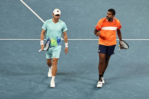 Rohan Bopanna (orange), IND, and Matthew Ebden, AUS, during mens doubles of 2024 Australian Open in Melbourne, 25 01 2023; -