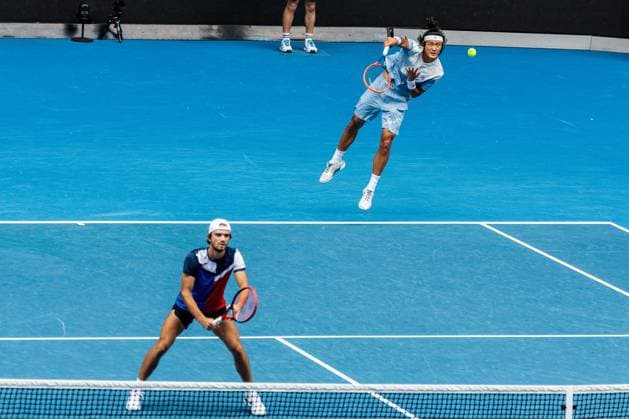 (240125) -- MELBOURNE, Jan. 25, 2024 -- Zhang Zhizhen (R) Tomas Machac compete during the men s doubles semifinal between Zhang Zhizhen (China) Tomas Machac (the Czech Republic) and Rohan Bopanna (India) Matthew Ebden (Australia) at Australian Open tennis tournament in Melbourne, Australia, Jan. 25, 2024. (Photo by Xinhua) (SP)AUSTRALIA-MELBOURNE-TENNIS-AUSTRALIAN OPEN-SEMIFINALS ChuxChen 