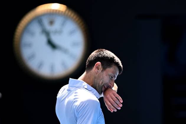 TENNIS AUSTRALIAN OPEN, Novak Djokovic of Serbia struggles during his Men?s semifinal against Jannik Sinner of Italy on Day 13 of the 2024 Australian Open at Melbourne Park in Melbourne, , Friday, January 26, 2024. ( NO ARCHIVING, EDITORIAL USE ONLY, NO USE IN BOOKS WITHOUT CONSENT MELBOURNE VICTORIA AUSTRALIA  Copyright: xJAMESxROSSx 20240126001893757731